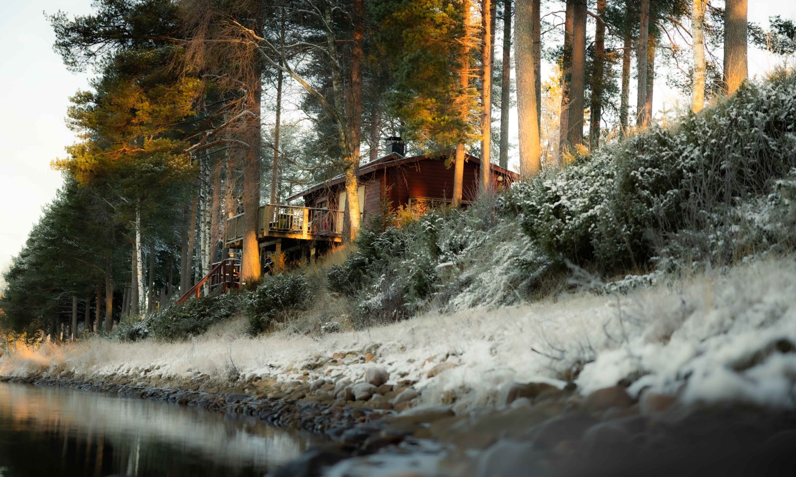 Traditional Finnish sauna with river view.
