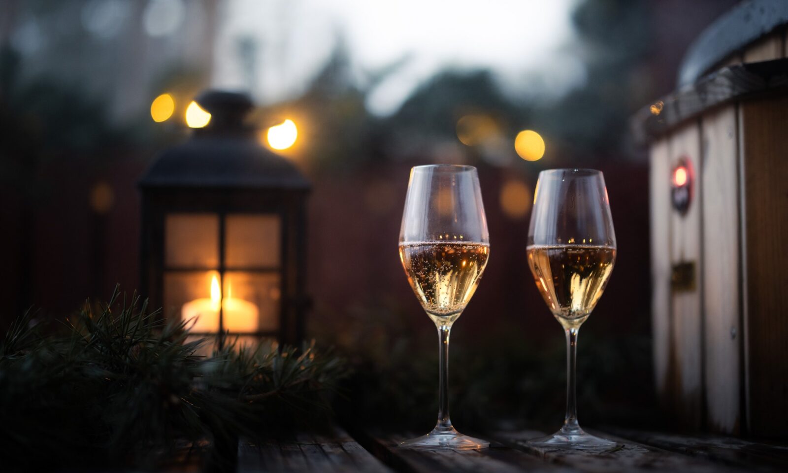 Two champagne glasses with candlelight