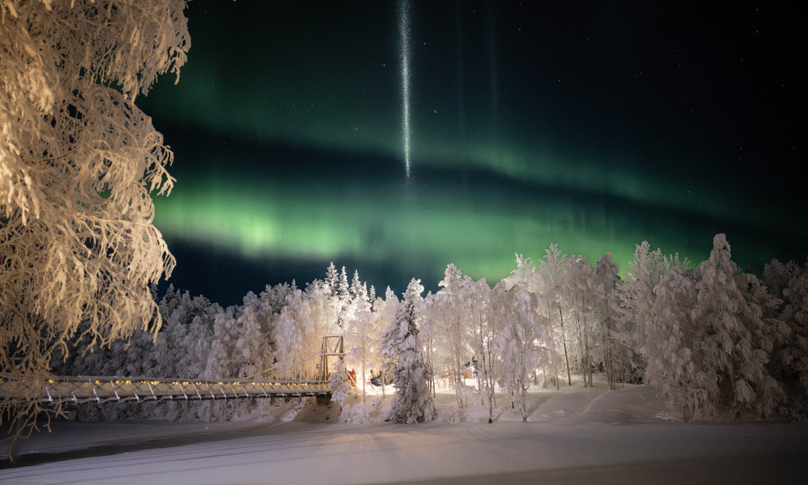 Northern Lights dancing above Aino Private Island Hotel, Rovaniemi, Lapland.