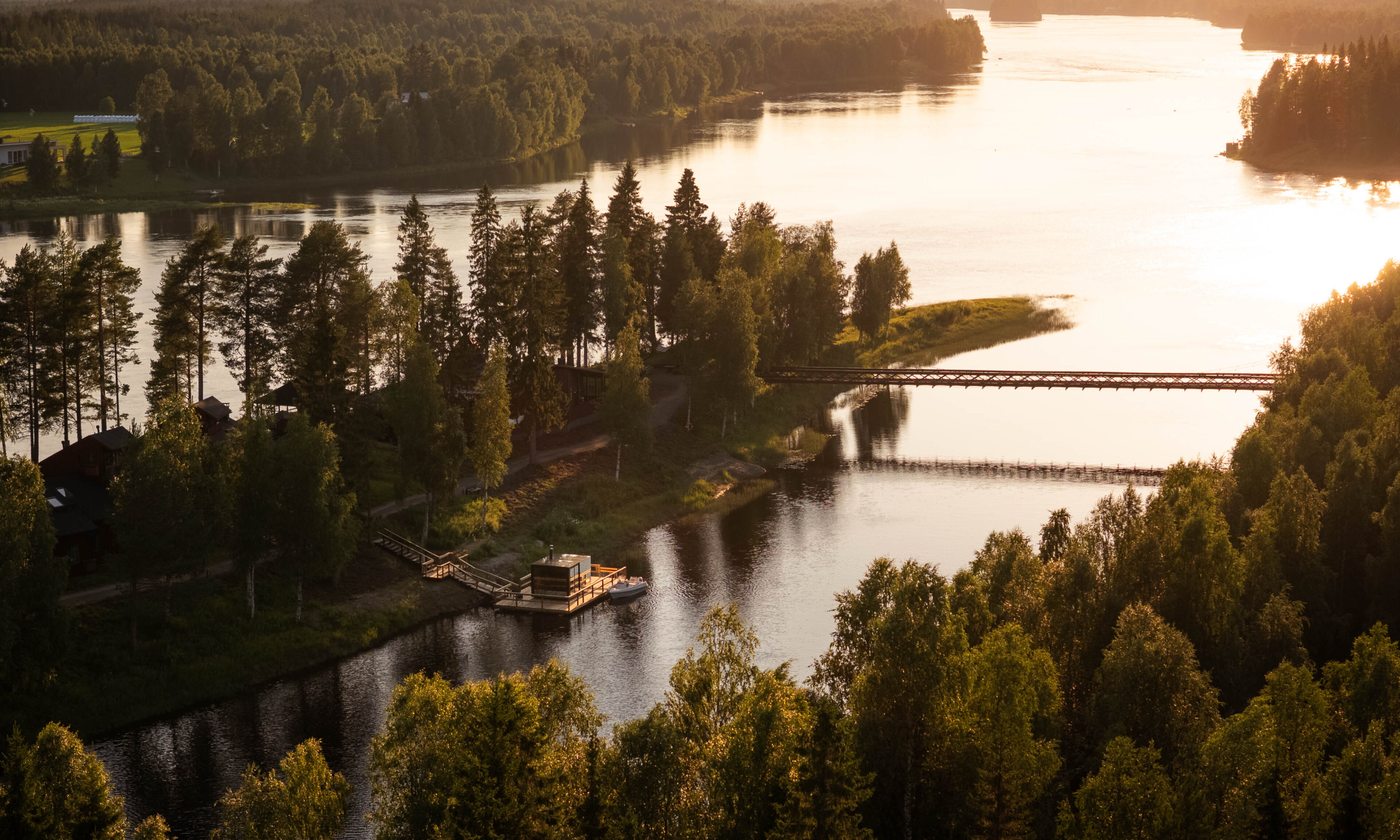 Aerial view of Aino Private Island and its bridge in Rovaniemi, Finnish Lapland